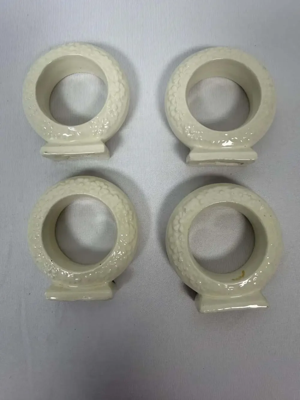 Set of 4 Vintage White Ceramic Floral Embossed Standing Napkin Rings